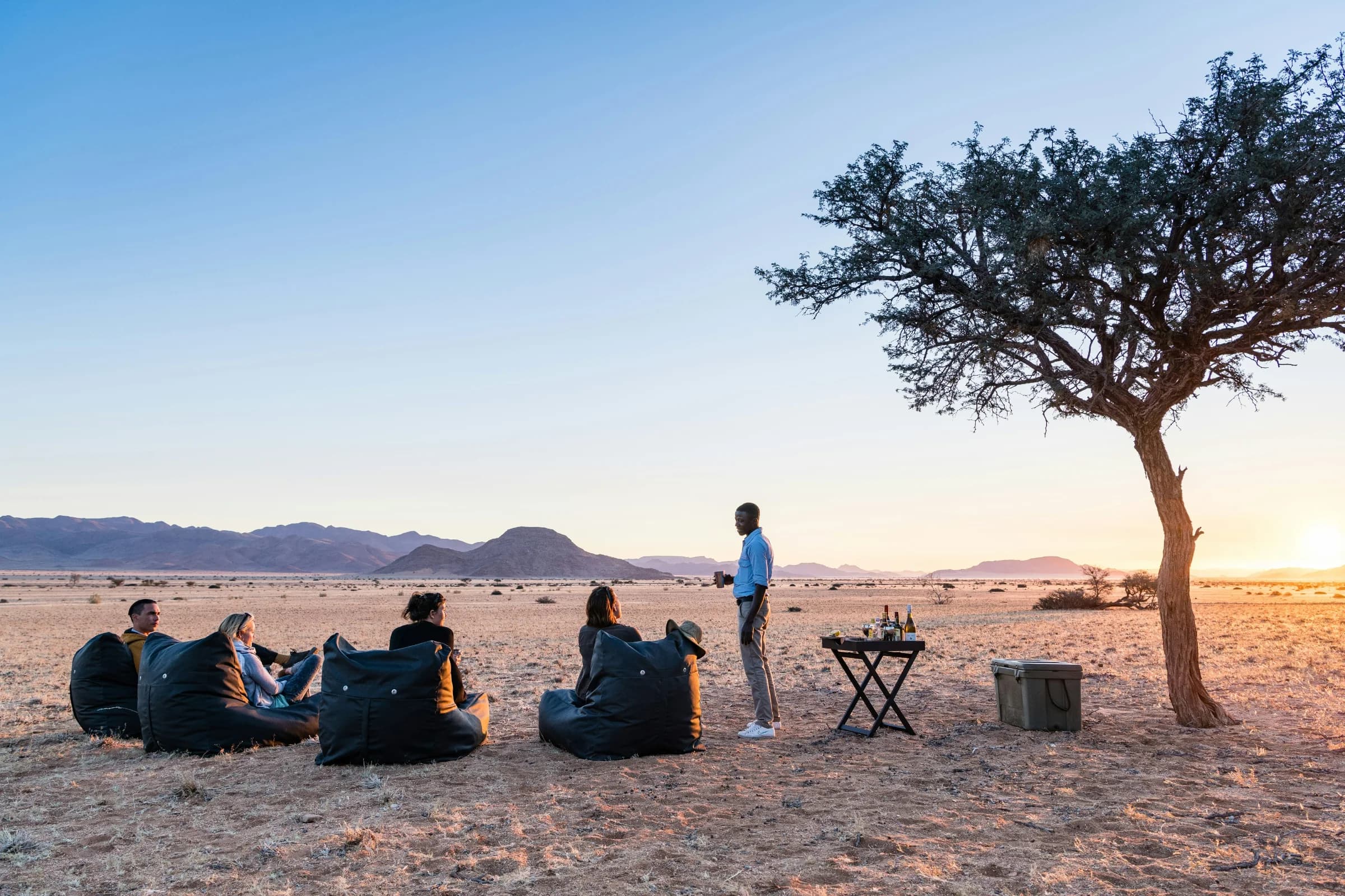 Travellers pausing together in a mountain landscape